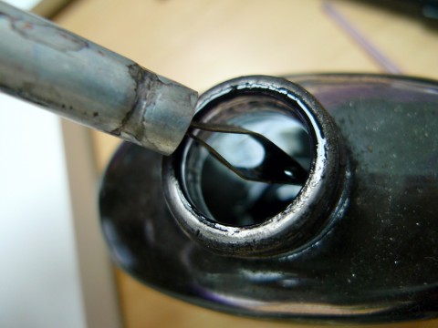 Automatic pen being dipped in ink